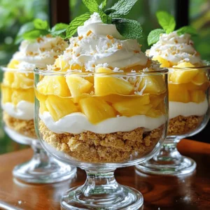 To make Pineapple Dream Dessert, you will need a few simple ingredients. Each one adds to the flavor and texture of this delightful treat. Here’s what you’ll need: - Ripe pineapple: peeled and diced - Cream cheese: 1 cup, softened - Whipped cream: 1 cup - Powdered sugar: ½ cup - Vanilla extract: 1 teaspoon - Crushed graham crackers: 1 cup - Unsweetened coconut flakes: ½ cup - Fresh mint leaves: for garnish Using fresh, ripe pineapple makes a big difference. It gives the dessert a bright, juicy flavor that blends well with the cream cheese and coconut. Softened cream cheese ensures a smooth mixture. The whipped cream adds lightness, while powdered sugar sweetens it perfectly. Crushed graham crackers provide a nice crunch in each bite. The unsweetened coconut flakes contribute a tropical twist. Don't forget the fresh mint leaves! They add a pop of color and a fresh taste right before serving. For the full recipe and instructions, be sure to check out the [Full Recipe]. - Step 1: Beat softened cream cheese until creamy. Use a mixer to make it smooth. - Step 2: Mix in powdered sugar and vanilla extract. This adds sweetness and flavor. - Step 3: Fold in whipped cream gently. This makes the mix light and fluffy. - Step 4: Combine diced pineapple with coconut flakes. This gives a tropical twist. - Step 5: Layer crushed graham crackers in serving dish. This forms a crunchy base. - Step 6: Spoon cream cheese mixture over graham crackers. Spread it evenly for balance. - Step 7: Add pineapple mixture on top. This layer brings freshness and color. - Step 8: Repeat layering process. Add more crackers, cream, and pineapple. - Step 9: Chill the dessert. Place it in the fridge for at least two hours. - Step 10: Garnish before serving. Use fresh mint leaves for a bright finish. This Pineapple Dream Dessert is simple and fun to make. You can find the Full Recipe listed above for more details! - Tip 1: Ensure cream cheese is sufficiently softened. Softening makes it easy to mix. You can leave it out for an hour or microwave it for about 10 seconds. - Tip 2: Use fresh pineapple for better flavor. Fresh fruit brightens the taste. Canned pineapple can be soggy and sweet. - Tip 3: Chill thoroughly for optimal taste and texture. Chilling lets the flavors blend. Aim for at least two hours in the fridge. - Tip 4: Use clear serving dishes for a beautiful display. Clear dishes let you show off the layers. This makes the dessert more appealing. - Tip 5: Add extra coconut flakes on top for texture. A sprinkle of coconut gives a nice crunch. It also adds a tropical feel to the dish. - Tip 6: Understanding calories and serving size is key. Each serving has around 300 calories. Knowing this helps you enjoy it in moderation. - Tip 7: Consider alternatives for healthier options. You can use Greek yogurt instead of cream cheese. This swap lowers calories and adds protein. {{image_2}} - Option 1: Use Greek yogurt instead of cream cheese. This swap cuts some fat while adding protein. The flavor stays creamy and rich. Greek yogurt gives a nice tang, too. - Option 2: Swap graham crackers for gluten-free alternatives. You can find many tasty options in stores. Almond flour or coconut flour blends are great choices for a gluten-free base. - Option 3: Add a splash of rum or coconut extract. A little rum gives the dessert a tropical kick. Coconut extract enhances the coconut flavor for extra fun. - Option 4: Mix in other fruits like strawberries or mango. These fruits add bright flavors and colors. They make the dessert even more refreshing on hot days. - Option 5: Serve with a drizzle of chocolate sauce. The chocolate adds richness to the sweet and fruity flavors. It looks great on top, too! - Option 6: Accompany with whipped cream or ice cream. A scoop of vanilla ice cream pairs well with this dessert. Whipped cream adds a light touch that everyone loves. For more details, check the Full Recipe. - Tip 1: Store in the refrigerator for freshness. This keeps the dessert cool and tasty. - Tip 2: Cover tightly to prevent drying out. Use plastic wrap or a lid to seal it well. - Tip 3: Can Pineapple Dream Dessert be frozen? Yes, you can freeze it. However, the texture may change slightly. - Tip 4: Best practices for thawing before serving. Move it to the fridge overnight. This way, it thaws slowly and keeps its taste. Q1: What is Pineapple Dream Dessert? Pineapple Dream Dessert is a light, no-bake treat. It has layers of cream cheese, whipped cream, and fresh pineapple. You also find crushed graham crackers and coconut flakes in it. This dessert is perfect for warm days or summer gatherings. Q2: How long does it take to prepare? The prep time is about 20 minutes. After that, you need to chill it for at least 2 hours. So, the total time is around 2 hours and 20 minutes. This dessert is quick to make but needs time to set. Q3: Can I make it ahead of time? Yes, you can make it a day ahead. Just chill it in the fridge. This helps the flavors mix well and makes it even tastier. Q4: What can I use instead of graham crackers? You can use crushed cookies like vanilla wafers or digestive biscuits. Gluten-free options work too, like almond flour cookies. These alternatives still give a nice crunch to your dessert. Q5: Is this dessert suitable for kids? Absolutely! Kids love the sweet flavors and bright colors. Just make sure they are not allergic to any ingredients. It’s a fun dessert that they can help make too! For the full recipe, check out the detailed instructions and tips above. In this post, we explored how to create a delicious Pineapple Dream Dessert. You learned about the key ingredients, step-by-step preparation, and tips for success. We also discussed fun variations to customize your dessert and how to store it properly. Remember, using fresh ingredients and following the steps closely leads to a tasty treat. Experiment with flavors and enjoy sharing this dessert with friends and family. Your Pineapple Dream Dessert is sure to impress!