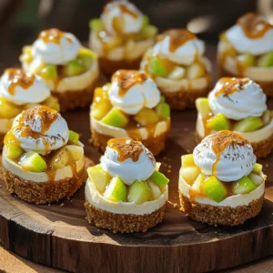 - 1 cup graham cracker crumbs - 8 ounces cream cheese, softened - 1 1/2 cups finely diced apples - 2 tablespoons sugar - 1/2 cup caramel sauce (store-bought or homemade) - Whipped cream, for topping (optional) - Mini muffin tin - Mixing bowls - Electric mixer The mini caramel apple cheesecake bites pull together flavors we love. The graham cracker crumbs create a sweet crust. Softened cream cheese gives it a rich base. Fresh apples add a juicy crunch. These bites hold a wonderful mix of sweet and tart. To make these bites, you need some simple tools. A mini muffin tin is key for shaping each bite. Mixing bowls help bring everything together. An electric mixer makes it easy to whip cream cheese into a smooth blend. When you gather your ingredients, ensure they are fresh. Fresh apples make a big difference in taste. Whether you choose store-bought caramel or make your own, both options work great. For the full recipe, remember to check the steps to achieve perfect bites every time! 1. Preheat your oven to 325°F (160°C). This step ensures your crust bakes evenly. 2. In a medium bowl, combine the graham cracker crumbs, 2 tablespoons sugar, and melted butter. Mix until the crumbs stick together. 3. Press about 1 tablespoon of this mixture into the bottom of each mini muffin cup. This forms a solid crust. 4. Bake in the preheated oven for about 5 minutes. Remove and let cool. 1. In another bowl, beat the softened cream cheese with 1/2 cup sugar and vanilla extract until creamy. This makes a smooth filling. 2. Add the egg and mix until fully incorporated. This adds richness to the filling. 1. In a small bowl, toss the diced apples with the cinnamon until evenly coated. This adds great flavor to your bites. 2. Fold the cinnamon apples into the cream cheese mixture. This step combines all the tasty ingredients. 3. Spoon the cheesecake mixture over the baked crusts in the mini muffin tin. Fill each cup about 3/4 full. 4. Bake for 15-18 minutes, or until the centers are set. The cheesecakes should have a slight jiggle in the middle. 5. Remove from the oven and let them cool at room temperature for about 15 minutes. 6. Transfer to the refrigerator to chill for at least 1 hour. 7. Before serving, drizzle the cooled mini cheesecakes with caramel sauce. Optionally, top with whipped cream. This recipe is simple yet rewarding. You can find the full recipe for more details on the process. To make your mini caramel apple cheesecake bites truly special, focus on the texture. Avoid overmixing the batter. This helps keep your cheesecake light and creamy. When you mix too much, air gets in, making it too fluffy. A smooth blend is all you need. Let the cheesecake cool gradually. After baking, let them sit at room temperature for about 15 minutes. Then, transfer them to the fridge for at least 1 hour. This cooling step helps set the cheesecake perfectly. When it's time to serve, drizzle with caramel sauce. This adds a rich layer of flavor. It looks great and tastes even better! You can also use whipped cream for extra indulgence. A dollop on top makes each bite even creamier. To make your bites look stunning, add a sprinkle of chopped nuts on top. Walnuts or pecans give a nice crunch. You can also use additional apples or a dash of cinnamon for garnish. This adds a pop of color and flavor, making your bites irresistible. These tips will help you create mini caramel apple cheesecake bites that wow your guests. For more details, check the Full Recipe. {{image_2}} You can easily switch up the fruit in these bites. Instead of apples, try pears or peaches. These fruits still bring sweetness and a nice texture. You can also experiment with berries, like raspberries or blueberries. They add a fresh and tangy kick to the cheesecake. If you want a richer taste, add chocolate chips to the filling. This will give your bites a decadent twist that chocolate lovers will enjoy. Another fun idea is to incorporate pumpkin spice. This adds warmth and depth, perfect for fall gatherings. For those with gluten needs, use gluten-free graham crackers. This keeps the recipe safe for everyone. If you need a dairy-free option, swap the cream cheese for dairy-free cream cheese. This way, everyone can enjoy these tasty treats without worry. Remember, you can find the full recipe for Mini Caramel Apple Cheesecake Bites in the earlier sections. You can keep mini caramel apple cheesecake bites in the fridge. Place them in an airtight container. They stay fresh for up to 5 days. If you want to save them for longer, you can freeze them. They will last up to 2 months in the freezer. When you’re ready to eat your frozen bites, thaw them overnight in the fridge. For the best taste, serve them chilled. This way, the flavors shine and the texture stays nice. If you have a party or a gathering, double the recipe. It makes a lot of bites, which everyone will love. You can also prepare the crust and filling ahead of time. This saves you stress and time on the day of your event. Making it easy for you to enjoy with friends and family. Yes, you can make them a day in advance and store them in the refrigerator. This helps the flavors blend, giving you a richer taste. Just cover them well with plastic wrap or place them in an airtight container. When you’re ready to serve, just add the caramel sauce and any toppings. You can use Greek yogurt or vegan cream cheese alternatives. Greek yogurt adds a nice tang and keeps the bites creamy. Vegan cream cheese works well for those avoiding dairy. Both options will keep the cheesecake bites light and delicious. The centers should be set with a slight jiggle, while the edges appear lightly golden. A toothpick inserted in the middle will come out mostly clean. This means they are ready to cool. Remember, they will firm up as they chill in the fridge. For the complete recipe, check out the [Full Recipe]. Enjoy making these bites! You learned how to make mini caramel apple cheesecake bites. We covered the key ingredients, tools, and step-by-step instructions. I shared tips on getting the right texture and serving ideas. You can customize the recipe with different fruits and flavors. Remember to store your treats properly for the best taste. These bites are perfect for any gathering or a sweet treat at home. Enjoy making and sharing these delicious desserts with friends and family!