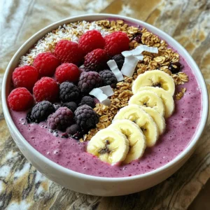 To make a great berry smoothie bowl, you need fresh and tasty ingredients. Here is the list of what you will need: - 1 cup frozen mixed berries (blueberries, raspberries, strawberries) - 1 banana, sliced - 1 cup almond milk (or any milk of choice) - 1 tablespoon chia seeds - 1 tablespoon honey or maple syrup (adjust for sweetness) - 1/2 teaspoon vanilla extract These ingredients help create a creamy and flavorful base. The frozen mixed berries give a nice chill and fruity taste. The banana adds creaminess and sweetness. Chia seeds provide fiber and a healthy boost. Toppings make your smoothie bowl fun and colorful. Here are some great choices to try: - Fresh berries (strawberries, blueberries, raspberries) - Sliced banana - Granola - Shredded coconut - Nuts (almonds, walnuts, or pecans) You can mix and match these toppings as you like. They add texture and extra flavor to your bowl. If you want to change things up, you can swap out some ingredients. Here are some ideas: - Milk: Use coconut milk, oat milk, or soy milk instead of almond milk. Each type has its own taste and creaminess. - Sweeteners: If you don’t have honey or maple syrup, try agave syrup or stevia. Just make sure to adjust the amount to fit your taste. These substitutions let you customize your smoothie bowl to match your needs or preferences. You can use the full recipe to guide your creation. To start, gather your ingredients. You will need: - 1 cup frozen mixed berries (blueberries, raspberries, strawberries) - 1 banana, sliced - 1 cup almond milk (or any milk of choice) - 1 tablespoon chia seeds - 1 tablespoon honey or maple syrup (adjust for sweetness) - 1/2 teaspoon vanilla extract In your blender, add the frozen berries, sliced banana, almond milk, chia seeds, honey, and vanilla. Blend these on high speed. Keep blending until the mix is smooth and creamy. If it’s too thick, add more almond milk. You want it just right for a bowl. To get a great texture, think about these tips: - Use frozen berries for a cold, thick mix. - Adjust the almond milk for your preferred thickness. - Blend longer if you want it super smooth. If it feels too runny, add more frozen fruit. For a thicker mix, less liquid is key. Once your smoothie is blended, pour it into a bowl. Smooth the top with your spoon. Now comes the fun part—adding toppings! Use fresh berries, sliced banana, granola, shredded coconut, and nuts. Arrange them nicely for a pretty look. Enjoy your Berry Bliss Smoothie Bowl right away. It’s a refreshing way to start your day! For more details on making this dish, check the Full Recipe. You can prepare your berry smoothie bowl in advance. It saves time on busy mornings. To do this, blend your smoothie base and store it in the fridge. Use a sealed container. It stays fresh for up to two days. When ready to eat, just pour it into a bowl. Add your toppings, and enjoy! Want to boost the taste and health? Add spinach or kale to your mix. They blend well with berries and add nutrients. You can also try adding nut butter for extra creaminess. This adds protein and healthy fats. For a sweet touch, try adding a bit of maple syrup or honey. Adjust the sweetness to your liking. A beautiful bowl looks good and makes eating fun! Smooth the top of your smoothie with a spoon. Arrange your toppings in a creative way. Use fresh berries, sliced bananas, and nuts. You can sprinkle some granola for crunch. A drizzle of honey adds a nice touch. Snap a photo before you dig in! {{image_2}} You can mix berries in many fun ways. Try using just strawberries for a sweet bowl. If you like tangy flavors, use raspberries. Blueberries add a nice color and taste. You can also use blackberries for a deep flavor. Mixing different berries gives you a unique taste each time. Adding spinach to your smoothie bowl boosts nutrition. Spinach has many vitamins and minerals. It blends well with berries and does not change the taste much. Just a handful of fresh spinach will work. Blend it in with your berries for a healthy twist. To make this bowl vegan, swap the honey for maple syrup. Use almond milk or oat milk instead of dairy milk. You can also try coconut yogurt as a base for creaminess. These changes keep your smoothie bowl tasty and plant-based. You can still enjoy a delicious bowl with these simple swaps. Check the Full Recipe for more detailed instructions. After making your berry smoothie bowl, you might have some left. You can store it in the fridge. Use an airtight container for best results. Keep it in the fridge for up to one day. The texture may change, so it’s best fresh. If you want to save it longer, consider freezing. To freeze smoothie packets, prepare your berries and other ingredients. Place them in freezer bags. Measure your ingredients for easy use later. Make sure to remove as much air as possible to avoid freezer burn. Label each bag with the date and contents. It is best to use them within three months. When you are ready to enjoy your smoothie, take a packet from the freezer. Let it thaw in the fridge overnight for best results. If you are in a hurry, you can thaw it in cold water for about 30 minutes. Once thawed, blend it with a splash of milk or water to restore its creamy texture. To make a thicker smoothie bowl, use less liquid. Start with one cup of almond milk. Add more frozen berries. You can add ice cubes too. Blend until it’s thick and creamy. If it’s too thin, add more frozen fruit. This gives your bowl a nice texture. Yes, you can use fresh berries. However, your smoothie bowl may be thinner. Frozen berries make the bowl cold and thick. If using fresh, add ice to help with thickness. Fresh berries can taste great too! Just remember to adjust the liquid. Berries are packed with vitamins and antioxidants. They help fight free radicals in your body. They are low in calories and high in fiber. This means they can keep you full longer. Berries also support heart health and boost your immune system. Adding them to your smoothie bowl is a tasty way to get these benefits. To make this smoothie bowl paleo-friendly, swap almond milk for coconut milk. Use honey or maple syrup as your sweetener. Ensure all toppings are paleo-friendly too. Use nuts, seeds, and fresh fruits as toppings. Avoid granola unless it’s made with paleo ingredients. Check labels to be safe. In this post, we explored how to craft a delicious berry smoothie bowl. We covered essential ingredients, step-by-step instructions, and tips to enhance flavor and nutrition. You learned about tasty variations and how to store your creations for later. Remember, experimenting with flavors can lead to great discoveries. A perfect smoothie bowl combines health and fun. Keep trying new recipes and enjoy!