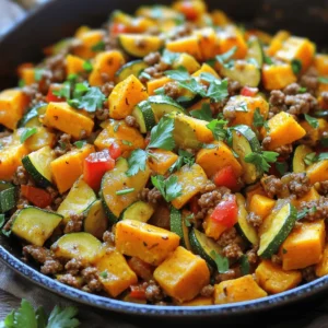 - 1 lb ground beef (lean) - 1 medium zucchini, diced - 1 medium sweet potato, diced - 1 small onion, finely chopped - 2 cloves garlic, minced - 1 red bell pepper, diced - 1 teaspoon smoked paprika - 1 teaspoon cumin - 1 tablespoon olive oil - Salt and pepper to taste - Fresh parsley or cilantro for garnish To make this Ground Beef Zucchini Sweet Potato Skillet, gather these simple ingredients. The ground beef gives a nice base. Zucchini and sweet potato add color and nutrition. Onion and garlic boost the flavor. The red bell pepper adds sweetness. Smoked paprika and cumin provide warmth. Olive oil helps in cooking and adds richness. Don't forget salt and pepper for taste. Finally, fresh herbs give a pop of freshness. - Additional vegetables (spinach, bell peppers, etc.) - Cheese (cheddar, feta, etc.) - Spices (chili powder, oregano, etc.) Feel free to customize your skillet with optional add-ins. Extra veggies like spinach can add more nutrients. Cheese can make it creamy and rich. Different spices can change the flavor profile and keep it interesting. This way, you can enjoy a new dish each time! For the full recipe, check out the recipe section above. - Wash and dice zucchini and sweet potato. - Chop onion and red bell pepper. - Mince garlic. Start by washing the zucchini and sweet potato under cold water. Cut them into small cubes. This helps them cook evenly. Next, chop the onion and red bell pepper. Mince two cloves of garlic. These will add great flavor to our dish. - Heat olive oil in a skillet. - Add diced sweet potato and cook. In a large skillet, heat one tablespoon of olive oil over medium heat. Once the oil is hot, add the sweet potato. Cook for about 5-7 minutes. Stir it occasionally. You want the sweet potato to soften but not fully cook just yet. - Sauté onion and garlic. - Brown ground beef in the skillet. After the sweet potatoes soften, add the chopped onion and minced garlic. Sauté for about 2-3 minutes. The onion should become translucent. Next, push the veggies to one side of the skillet. Add one pound of ground beef to the other side. Break it up with a spatula. Cook until it turns brown, which takes about 5-6 minutes. - Mix all ingredients in the skillet. - Add seasonings and stir well. Now it’s time to combine everything! Mix the ground beef with the sweet potatoes and veggies. Add the diced zucchini and red bell pepper. Sprinkle in one teaspoon of smoked paprika, one teaspoon of cumin, and salt and pepper to taste. Stir everything well to combine the flavors. - Continue cooking until veggies are tender. Keep cooking the skillet mixture for another 8-10 minutes. Stir occasionally. You want the zucchini to become tender and the sweet potatoes to be fully cooked. - Taste and adjust seasoning. - Garnish and serve hot. Before serving, taste the dish. Adjust the seasoning if needed. Remove the skillet from heat and garnish with fresh parsley or cilantro. Serve this warm and enjoy your delicious meal! For the full recipe, check out the link. - Cut your zucchini and sweet potato into even pieces for the best cook. - Choose lean ground beef to keep the dish lighter. - Fresh herbs like basil or parsley can boost flavor. - Try different spices, such as chili powder or oregano, to mix it up. - A cast-iron skillet holds heat well and helps with even cooking. - Stir the skillet occasionally to stop food from sticking. These simple tips can help you create a tasty Ground Beef Zucchini Sweet Potato Skillet. Follow the Full Recipe for step-by-step guidance! {{image_2}} You can make this dish lighter. Swap ground beef for turkey or a plant-based protein. Both options taste great and cut down on fat. You can also use butternut squash instead of sweet potato. It adds a sweet flavor and a nice texture. Want to spice things up? Add taco seasoning for a Mexican twist. It gives the dish a bold flavor. For an Asian twist, try soy sauce and ginger. These ingredients add a savory taste that pairs well with the veggies. To make this meal more filling, add grains like quinoa or rice. They boost fiber and nutrition. You can also toss in canned beans for extra protein. Beans make this dish heartier and ideal for a complete meal. To store leftovers, place the skillet mixture in an airtight container. Make sure it cools to room temperature first. This helps keep the food fresh. In the fridge, your Ground Beef Zucchini Sweet Potato Skillet will stay good for about 3 to 4 days. For freezing, let the dish cool completely. Then, divide it into portions and use freezer-safe bags or containers. Remove as much air as possible to prevent freezer burn. When you’re ready to eat, thaw it in the fridge overnight. Reheat in a skillet over low heat until warmed through. Portion the dish into containers for quick meals throughout the week. This makes lunch or dinner easy. For safe thawing, always use the fridge or microwave. Avoid thawing at room temperature to keep it safe to eat. Enjoy your yummy, prepped meals! This dish takes about 10 minutes to prep and 20 minutes to cook. In total, you will spend around 30 minutes from start to finish. Yes, you can make this recipe ahead of time. Cook the skillet and let it cool. Store it in an airtight container in the fridge for up to three days. You can also freeze it. Just make sure to thaw it overnight in the fridge before reheating. You can serve this skillet with a side salad or some crusty bread. It also pairs well with rice or quinoa for a heartier meal. Adding fresh herbs like parsley or cilantro as a garnish brightens the dish. Yes, this recipe is gluten-free. All the ingredients used do not contain gluten. If you use packaged items, check labels to ensure they are gluten-free. You can use frozen vegetables in this recipe. Just add them to the skillet after the sweet potatoes soften. Frozen veggies cook faster, so you may need to adjust the cooking time. In this blog post, I've shared how to make a tasty Ground Beef Zucchini Sweet Potato Skillet. You learned about the key ingredients, step-by-step cooking instructions, and useful tips. I also covered variations and storage options to help you enjoy this dish multiple times. Remember, cooking is fun, and you can make this recipe your own. Try different spices and veggies! Keep experimenting, and enjoy every bite.