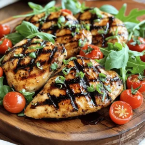 - 4 boneless, skinless chicken breasts - 1/2 cup balsamic vinegar - 3 tablespoons honey - 2 tablespoons olive oil - 3 cloves garlic, minced - 1 teaspoon dried oregano - 1 teaspoon salt - 1/2 teaspoon black pepper - Fresh basil leaves for garnish - Optional: cherry tomatoes and arugula for serving Gather these ingredients before you start. The chicken breasts are the star. The balsamic vinegar and honey mix gives a nice sweet flavor. Olive oil keeps the chicken moist. Garlic, oregano, salt, and pepper add savory notes. Fresh basil gives a pop of color and taste. If you want, add cherry tomatoes and arugula on the side. They make the plate look nice and add freshness. This simple list makes a tasty dish. You can find the full recipe in the article. Enjoy the cooking process! To start, you need to make a rich balsamic glaze. First, take a small saucepan and add: - 1/2 cup balsamic vinegar - 3 tablespoons honey Place the saucepan over medium heat. Bring the mixture to a gentle simmer. Stir it occasionally. This helps blend the flavors well. After it starts to simmer, reduce the heat to low. Let it cook for about 10 to 15 minutes. The goal is to thicken the glaze. Once thickened, remove it from the heat and set it aside to cool. Next, focus on marinating the chicken. In a bowl, whisk together these ingredients: - 2 tablespoons olive oil - 3 cloves garlic, minced - 1 teaspoon dried oregano - 1 teaspoon salt - 1/2 teaspoon black pepper This mixture will add a lot of flavor. Now, take your chicken breasts and place them in a large resealable bag or a shallow dish. Pour the marinade over the chicken. Seal the bag or cover the dish. You should refrigerate it for at least 30 minutes. For better flavor, let it sit for up to 2 hours. Now it’s time to grill the chicken. Preheat your grill to medium-high heat. This step is very important for even cooking. Once preheated, remove the chicken from the marinade and discard the leftover marinade. Place the chicken on the grill. Cook it for about 6 to 7 minutes on each side. The chicken is ready when it reaches an internal temperature of 165°F (75°C). You want it to be nicely charred on the outside. In the last few minutes of grilling, brush the chicken with the balsamic glaze. This adds a shiny finish and intense flavor. Once cooked, take the chicken off the grill and let it rest for a few minutes. This helps keep it juicy. Slice and serve it with a drizzle of glaze and fresh basil leaves. If you like, add cherry tomatoes and arugula for a nice touch. For the full recipe, check out the earlier section. To get the best grilled chicken, start with the right grill. Preheat your grill to medium-high heat, around 375°F to 450°F. This temperature gives a great sear and cooks the chicken evenly. Grill the chicken for 6-7 minutes on each side. You want the chicken to reach an internal temperature of 165°F. Use a meat thermometer to check this. Marination is key for flavor. I suggest marinating the chicken for at least 30 minutes. For a deeper flavor, go for 2 hours. This helps the chicken soak up the balsamic vinegar and honey. Balancing sweetness and acidity is important too. The honey adds sweetness, while the balsamic vinegar brings acidity. Adjust these to your taste before grilling. When serving, think about presentation. Slice the chicken and arrange it on a nice platter. Drizzle more balsamic glaze on top for a glossy finish. Add fresh basil leaves for a pop of color. You can also serve with cherry tomatoes and arugula for added freshness. Great sides include roasted veggies, rice, or a simple salad. These will pair well with the chicken and make a complete meal. For the full recipe, check the details above. {{image_2}} You can switch up the flavor of grilled chicken by trying different marinades. A citrus marinade adds a bright touch. Use lemon juice or orange juice mixed with olive oil and herbs. This gives your chicken a fresh, zesty twist. Another option is to use an herb-based marinade. Mix fresh herbs like rosemary, thyme, or parsley with olive oil. This adds a fragrant note and enhances the chicken's taste. Want some heat? Add spices like chili powder or cayenne. A sprinkle can transform your dish into a spicy delight. To make this dish gluten-free, simply check your balsamic vinegar for any added gluten. Most brands are safe, but it's always good to read labels. If you're looking for low-carb options, skip the honey in the glaze. You can use a sugar-free sweetener instead. This keeps the dish tasty without the extra carbs. Feel free to substitute chicken with other proteins. Turkey works well and has a similar flavor. For a plant-based twist, use tofu. Just make sure to press the tofu to remove extra moisture before marinating. This helps it absorb the flavors better. These variations allow you to customize grilled chicken with balsamic glaze to fit your taste and dietary needs. Enjoy exploring different flavor profiles! To store leftover grilled chicken, first let it cool down. Then, wrap the chicken tightly in plastic wrap or foil. You can also place it in an airtight container. This helps keep the chicken fresh. Store it in the fridge for up to four days. When reheating, place the chicken on a microwave-safe plate. Cover it with a damp paper towel to keep it moist. Heat in short bursts, about 30 seconds at a time. Check the temperature often. The chicken should reach 165°F (75°C) before you eat it. For best results, you can also reheat it on the stovetop or in the oven. This keeps the outside crispy. Yes, you can freeze grilled chicken! Freezing is a great way to keep it longer. To freeze, let the chicken cool completely. Wrap each piece tightly in plastic wrap, then place them in freezer bags. Make sure to remove as much air as possible. Label the bags with the date. You can freeze it for up to three months. To thaw, place the frozen chicken in the fridge overnight. This keeps it safe to eat. If you need it faster, you can use the microwave’s defrost setting. Just remember to cook it right away after thawing. This way, you’ll enjoy that tasty grilled chicken later! For the full recipe of Grilled Chicken with Balsamic Glaze, check out the detailed instructions above. What is the best way to ensure the chicken stays juicy? To keep chicken juicy, marinate it. The marinade helps to infuse flavor and moisture. Let it soak for at least 30 minutes. The longer, the better. Also, avoid overcooking the chicken. Aim for an internal temperature of 165°F. Can I make the balsamic glaze in advance? Yes, you can make the balsamic glaze ahead of time. Cook it, then let it cool. Store it in the fridge for up to a week. Reheat it gently before using. How long can grilled chicken be stored in the fridge? Grilled chicken can last in the fridge for about 3 to 4 days. Keep it in an airtight container to maintain freshness. Is it safe to reheat grilled chicken? Yes, it is safe to reheat grilled chicken. Heat it to an internal temperature of 165°F. This ensures it is safe to eat. What sides go well with Grilled Chicken with Balsamic Glaze? Pair grilled chicken with fresh salads, roasted vegetables, or garlic bread. Quinoa or rice also complements the dish well. These sides balance the flavors of the glaze. Can I use bone-in chicken for this recipe? You can use bone-in chicken, but adjust the cooking time. Bone-in pieces take longer to cook. Ensure they reach 165°F for safe eating. In this blog post, we explored a tasty grilled chicken recipe with balsamic glaze. We covered key ingredients, step-by-step instructions, and tips for perfect grilling. You learned about variations and storage tips to keep your chicken fresh. As you cook this dish, remember to enjoy the process. Grilled chicken with balsamic glaze is versatile and delicious. So, gather your ingredients, fire up the grill, and impress your friends and family!