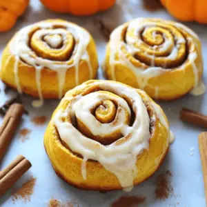 - 2 1/4 teaspoons active dry yeast - 1/2 cup warm milk (about 110°F) - 1/4 cup granulated sugar - 1/4 cup unsalted butter, melted - 1/2 cup pure pumpkin puree These ingredients are the backbone of your pumpkin cinnamon rolls. The active dry yeast makes the rolls rise, giving them that soft, fluffy texture. Warm milk helps the yeast work better, while sugar feeds the yeast and adds sweetness. Butter adds richness, and pumpkin puree gives flavor and moisture. - 1 teaspoon vanilla extract - 1 large egg - 3 1/2 to 4 cups all-purpose flour - 1 teaspoon salt - 1 tablespoon ground cinnamon Vanilla extract adds a warm note to the rolls. The egg helps bind everything and adds to the softness. Flour makes up most of the dough, while salt balances the flavors. Ground cinnamon gives that classic cozy taste we love in cinnamon rolls. - 4 oz cream cheese, softened - 1/4 cup unsalted butter, softened - 1 cup powdered sugar - 1 teaspoon vanilla extract - 1-2 tablespoons milk (to desired consistency) The cream cheese frosting is the perfect finish for these rolls. Cream cheese and butter create a rich base. Powdered sugar sweetens it, while vanilla adds flavor. Use milk to get the right thickness for drizzling over warm rolls. For the full recipe, check the detailed steps provided. 1. In a small bowl, combine warm milk, yeast, and one tablespoon of sugar. Let it sit for about 5-10 minutes until frothy. 2. In a large bowl, whisk together melted butter, pumpkin puree, vanilla extract, and egg. 3. Pour the frothy yeast mix into the pumpkin mixture, then stir to combine. 4. In another bowl, mix 3 1/2 cups of flour, remaining sugar, salt, cinnamon, nutmeg, and ginger. Gradually add this dry mix to the wet mixture, stirring until a dough forms. 1. Knead the dough on a floured surface for about 5-7 minutes. The dough should be smooth and elastic. 2. Place the dough in a greased bowl. Cover it with a damp cloth and let it rise in a warm area for about 1 hour, or until it doubles in size. 1. Once the dough has risen, punch it down. Roll it out on a floured surface into a rectangle, about 12x18 inches. 2. Spread melted butter over the dough, leaving a small border. Sprinkle brown sugar and cinnamon evenly on top. 3. Starting from the long edge, tightly roll the dough into a log. Cut the log into 12 equal rolls and place them in a greased baking dish. 4. Cover the rolls and let them rise for another 30-45 minutes until puffy. 5. Preheat the oven to 350°F (175°C). Bake the rolls for 25-30 minutes or until they are golden brown. For the full recipe and details, refer to the [Full Recipe]. To knead effectively, press the dough with your palms. Fold it over and repeat. This creates a smooth texture. Knead for about 5-7 minutes. You can add flour if it sticks too much. To know when your dough has risen enough, look for size. It should double in volume. You can also gently poke it. If it springs back slowly, it’s ready. For cream cheese frosting, start with softened cream cheese and butter. Mix them until smooth. Gradually add powdered sugar. If it's too thick, add milk a little at a time. You want it spreadable but not runny. To enhance frosting flavor, try adding a pinch of salt. You can also add a splash of maple syrup or vanilla. These small changes can make a big difference. Pumpkin cinnamon rolls pair well with coffee or chai tea. They also go great with a scoop of vanilla ice cream. I love enjoying them for breakfast or as an afternoon treat. The best time to enjoy these rolls is warm from the oven. They taste amazing fresh but are also delightful the next day! For more tips, check out the Full Recipe. {{image_2}} You can make pumpkin cinnamon rolls even better by adding nuts or dried fruits. Chopped pecans or walnuts add a nice crunch. Dried cranberries or raisins give a sweet touch. You can also try using spices like allspice or cloves. These spices add warmth and depth to the flavor. If you want to switch up the frosting, try a maple glaze instead of cream cheese frosting. It brings a unique flavor that pairs well with pumpkin. You can also drizzle melted chocolate on top for a rich treat. Both options are simple and add a fun twist. For gluten-free cinnamon rolls, use a gluten-free flour blend. Make sure it has xanthan gum for better texture. For a vegan version, replace the egg with flaxseed meal mixed with water. You can use almond milk instead of regular milk for the dough. These substitutions keep the rolls soft and tasty. After baking your pumpkin cinnamon rolls, let them cool down. Once cool, you can store leftovers in the fridge. Place them in an airtight container to keep them fresh. This helps prevent the rolls from drying out. They can last about five days in the fridge. If you want to save your pumpkin cinnamon rolls for later, freezing is a great option. To freeze, wrap each roll in plastic wrap. Then, place them in a freezer-safe bag. They can stay good for up to three months. When you're ready to eat, simply thaw them in the fridge overnight. Reheat in the oven at 350°F for about 10 minutes to bring back their warm, soft texture. To keep your rolls soft and fluffy, avoid moisture buildup. Make sure the container is dry before adding the rolls. If you see condensation, it’s best to switch containers. When reheating, cover the rolls with a damp paper towel. This will help lock in moisture while they warm up. Enjoy your delicious pumpkin cinnamon rolls anytime with these simple storage tips! For the complete recipe, check out the Full Recipe. To add more flavor, use fresh spices like cinnamon, nutmeg, and ginger. You can also mix in chopped nuts or dried fruits. Adding a pinch of salt enhances the sweetness too. I like to use a piping bag for the cream cheese frosting. It helps me get even lines and a nice design. You can also spread it with a knife for a more rustic look. Yes, you can! Prepare the dough and let it rise. Then, shape the rolls and place them in the baking dish. Cover them tightly and store in the fridge. Bake them fresh the next day. If your dough isn’t rising, check the yeast. It should be fresh and activated in warm milk. If it’s not frothy after 10 minutes, it’s likely dead. Start again with new yeast. These rolls last about 2-3 days at room temperature. Keep them in an airtight container to stay fresh. You can also freeze them for up to 2 months. Absolutely! Canned pumpkin puree works great in this recipe. Just make sure it’s pure pumpkin with no added spices or sugar. This makes it easy and quick to whip up your rolls. For the Full Recipe, check out the detailed instructions above. You’ve learned to make delicious pumpkin cinnamon rolls using fresh ingredients. We covered key components like yeast, pure pumpkin puree, and cream cheese frosting. You now know how to prepare, knead, and bake your rolls, plus tips for perfecting your dough and frosting. Experiment with exciting variations or follow our storage tips to keep them fresh. Enjoy making pumpkin cinnamon rolls that impress everyone!